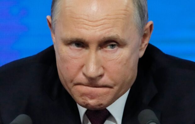 путін